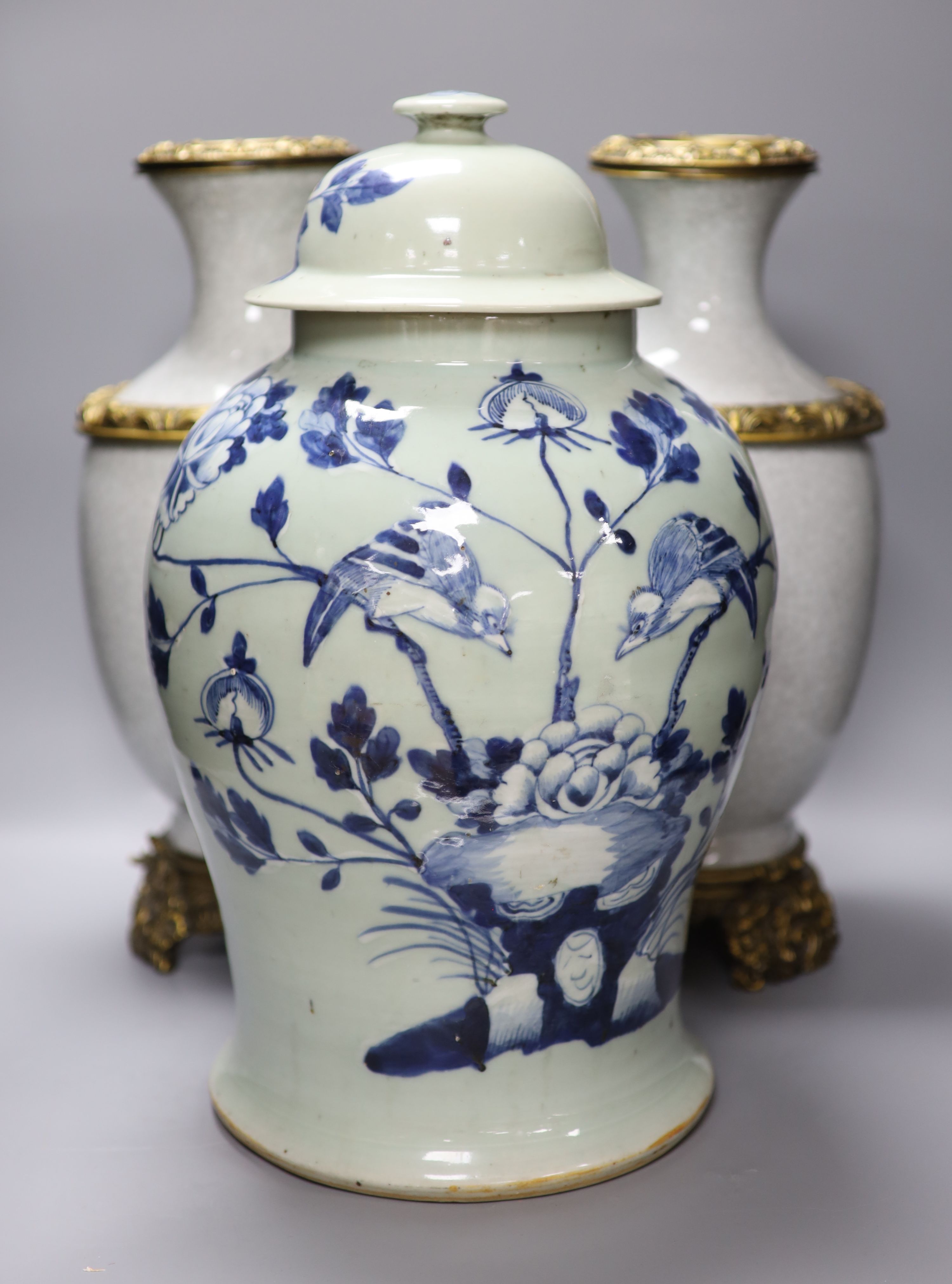 A pair of Chinese crackleglaze vases and a blue and white vase and cover, height 43cm